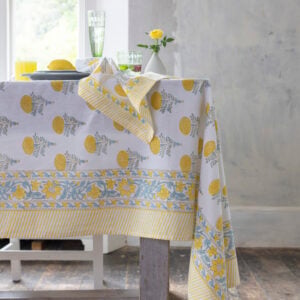 Lemon Cotton Hand Block Print Tablecloth | Lemon Cotton Hand Block Print Napkin | Stem Vases Asst Designs | Champagne Flute Etched in Green & Clear | Rustic Scalloped Pillar Candle Lemon