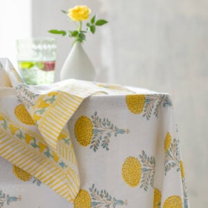 Lemon Cotton Hand Block Print Tablecloth | Lemon Cotton Hand Block Print Napkin | Stem Vases Asst Designs | Champagne Flute Etched in Green & Clear | Rustic Scalloped Pillar Candle Lemon